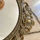Miroir ovale en laiton doré