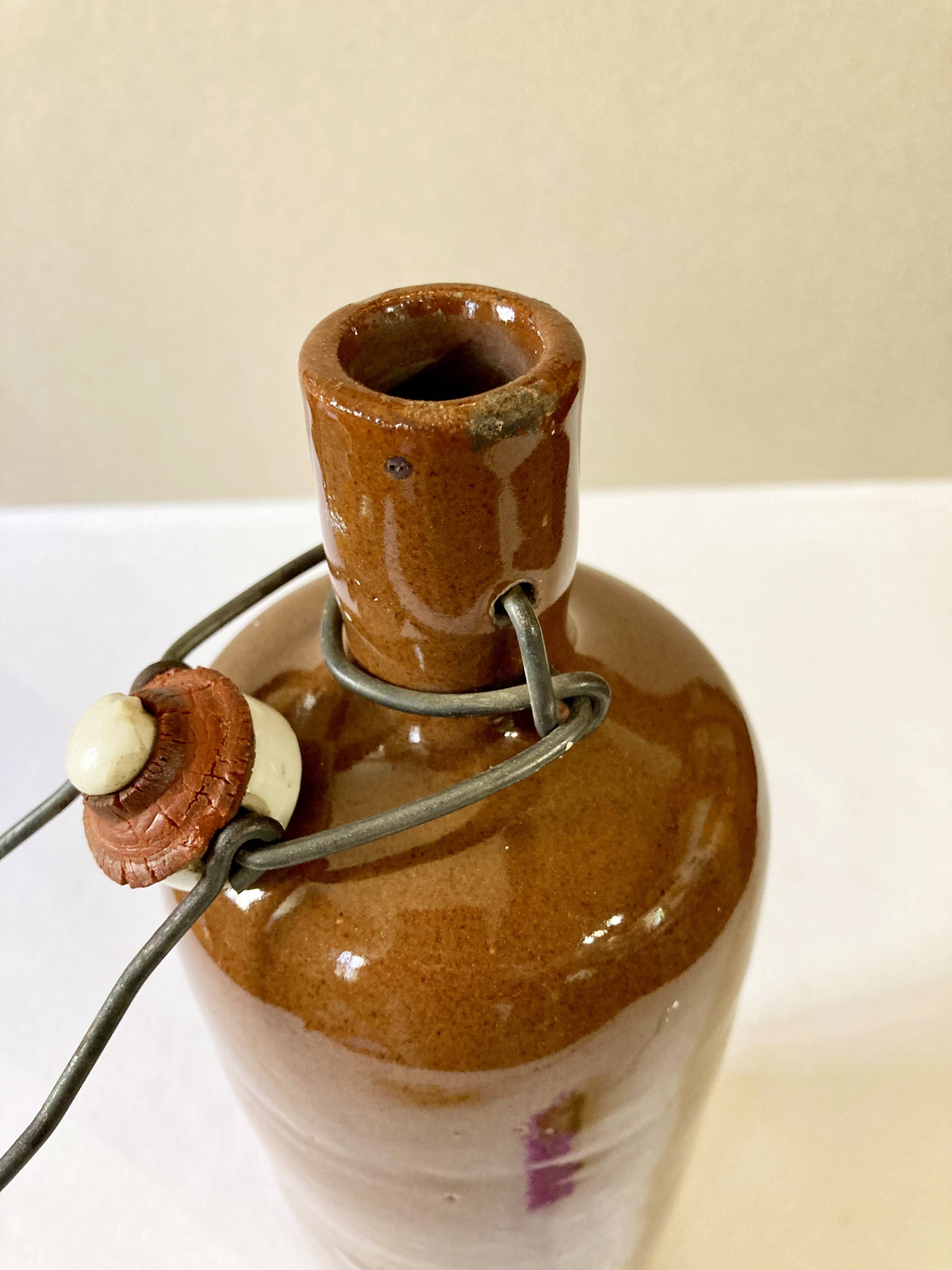 Bottle / hot water bottle in brown enamelled stoneware