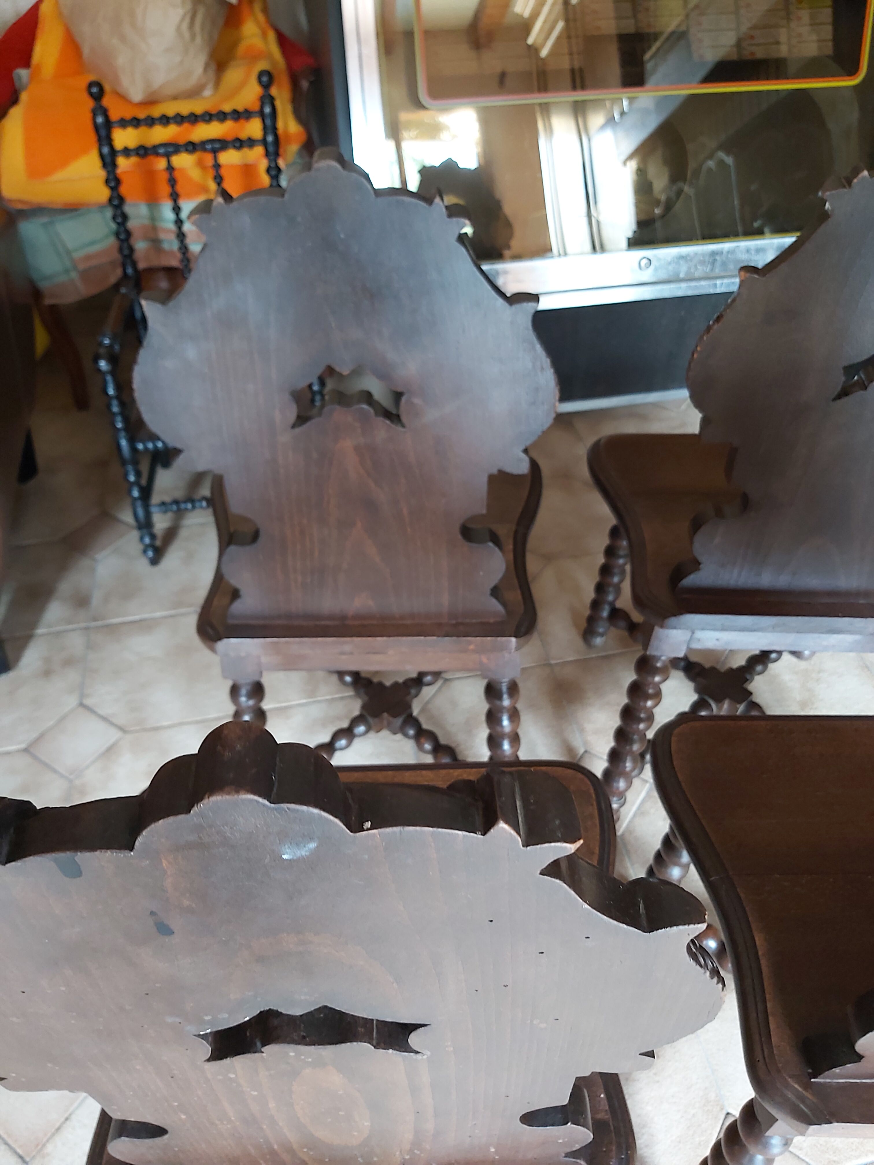 4 stylized dolphin back chairs