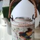 Japanese ceramic teapot. bird/paradise motifs/cherry trees. bamboo/rattan braided handle