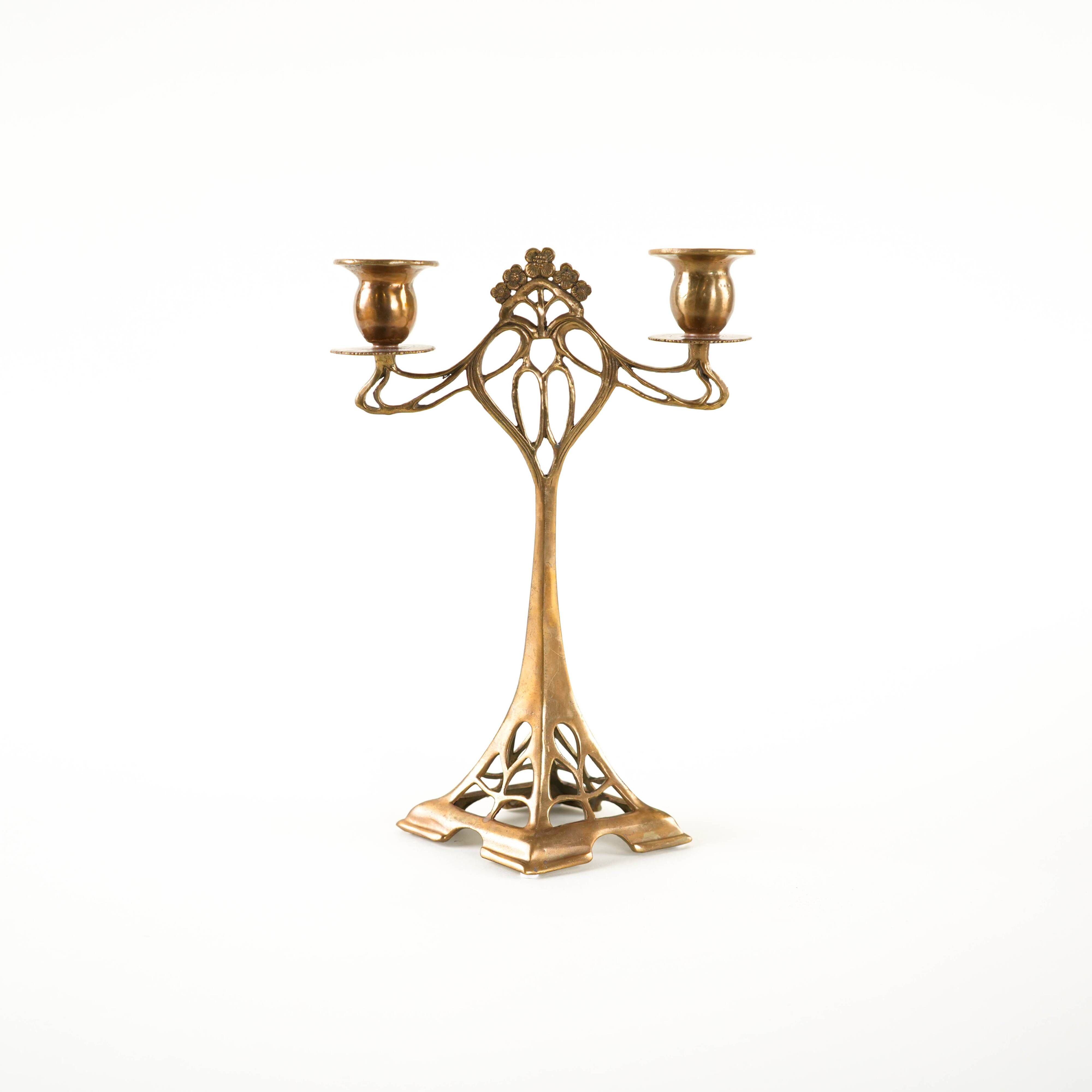 Art Nouveau brass candlestick with floral ornamentation, two arms, European