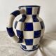 Antique blue and white checkered pitcher