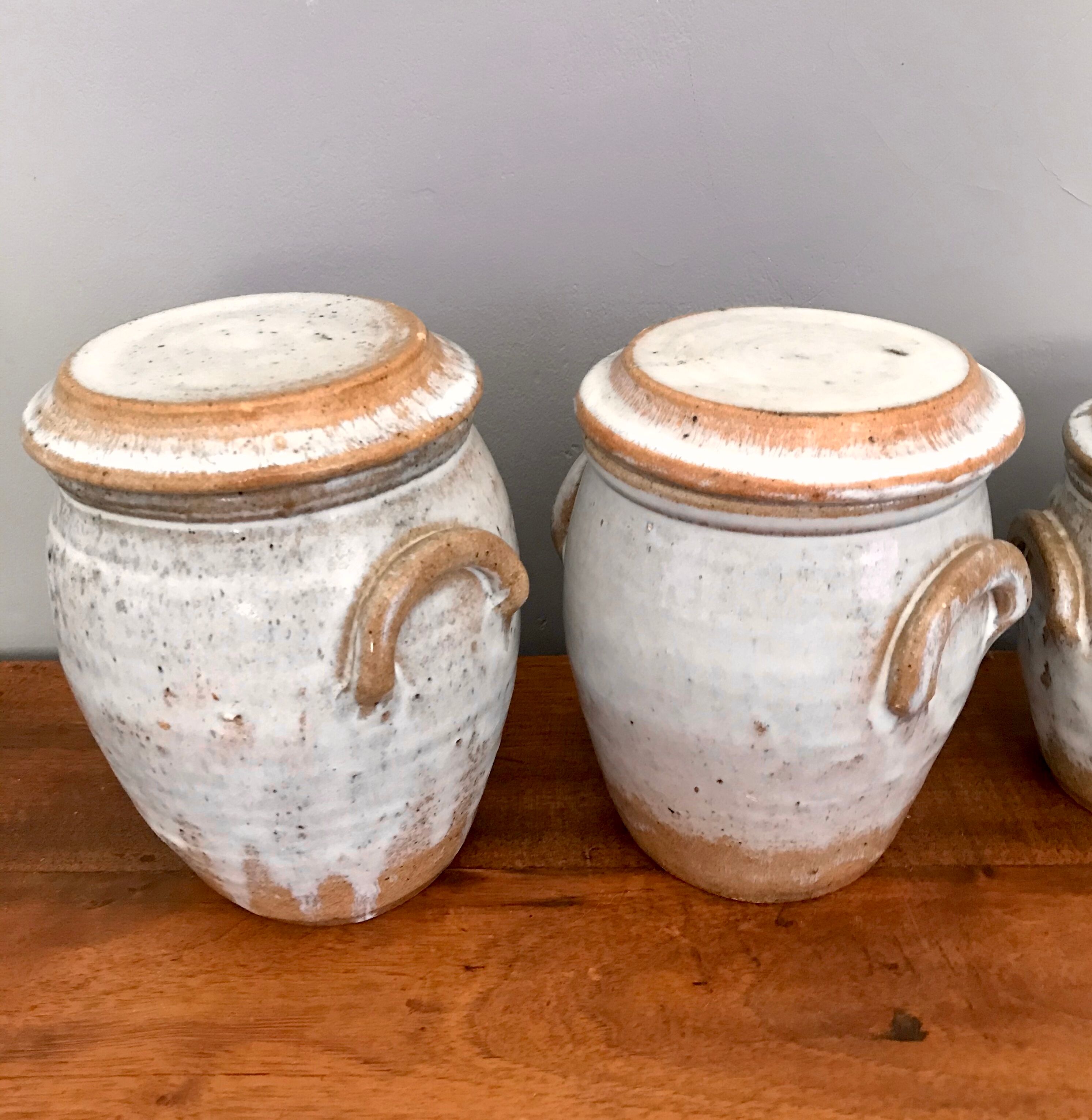Suite of antique enamelled ceramic pots