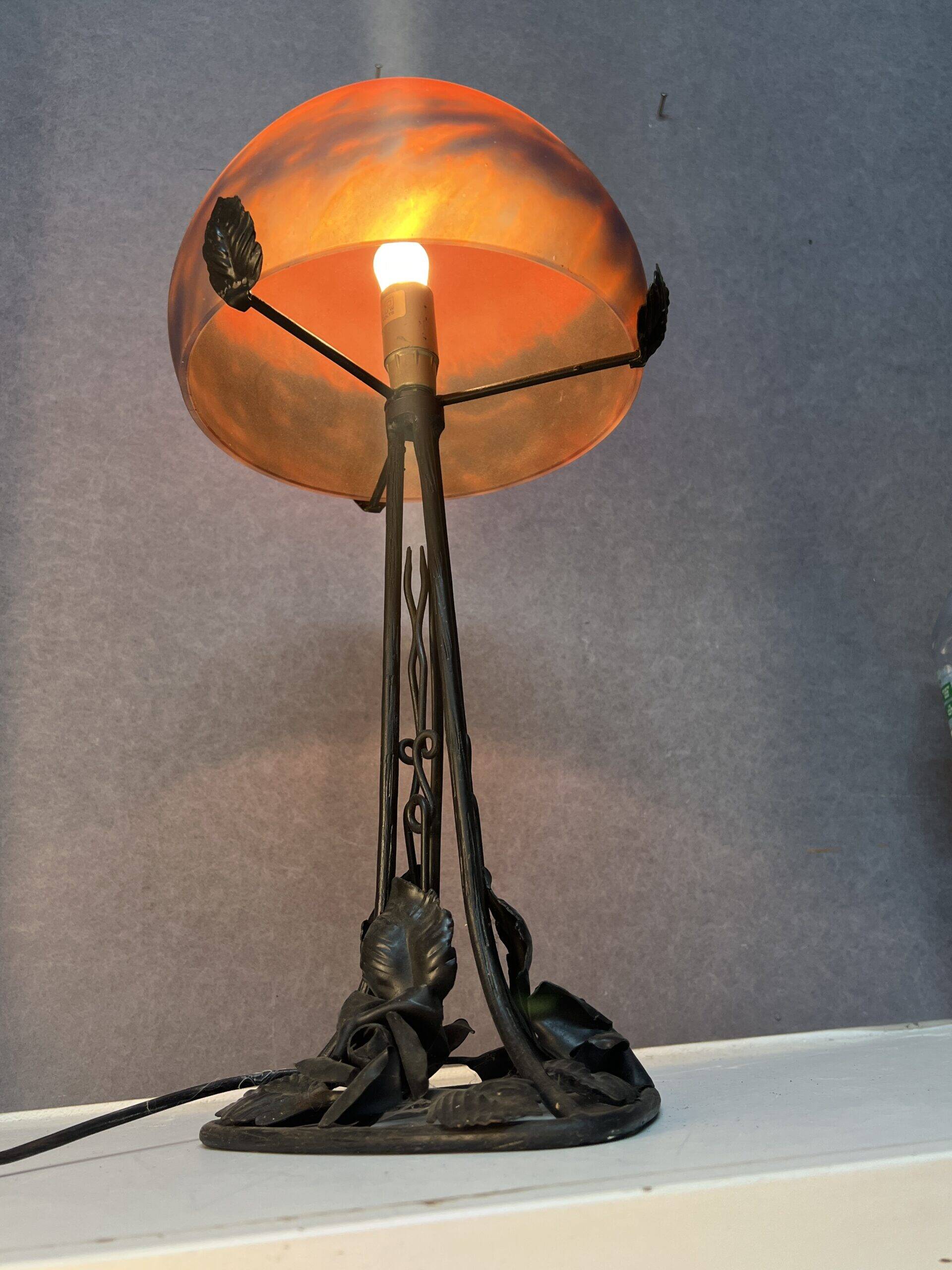 Contemporary mushroom lamp, wrought iron base and orange glass shell with blue hues in the art deco style