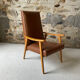 Vintage armchair in wood and brown faux leather