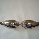 Salt and pepper shaker on silver metal tray in the shape of a duck art deco style
