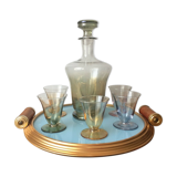 Aperitif liqueur service in iridescent glass on tray