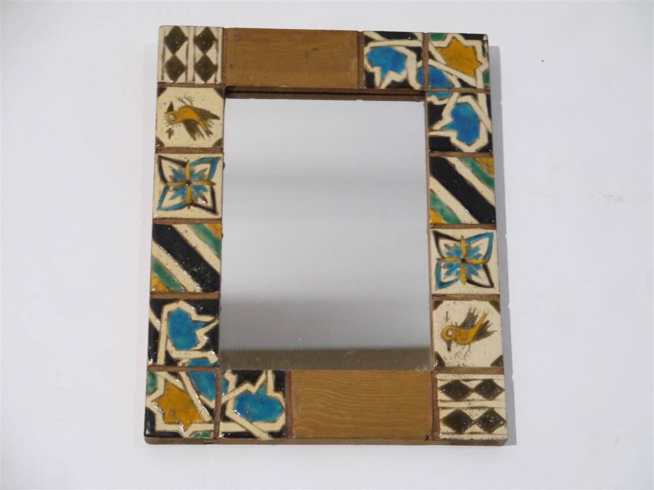 Miroir stylisé en bois et email 1960