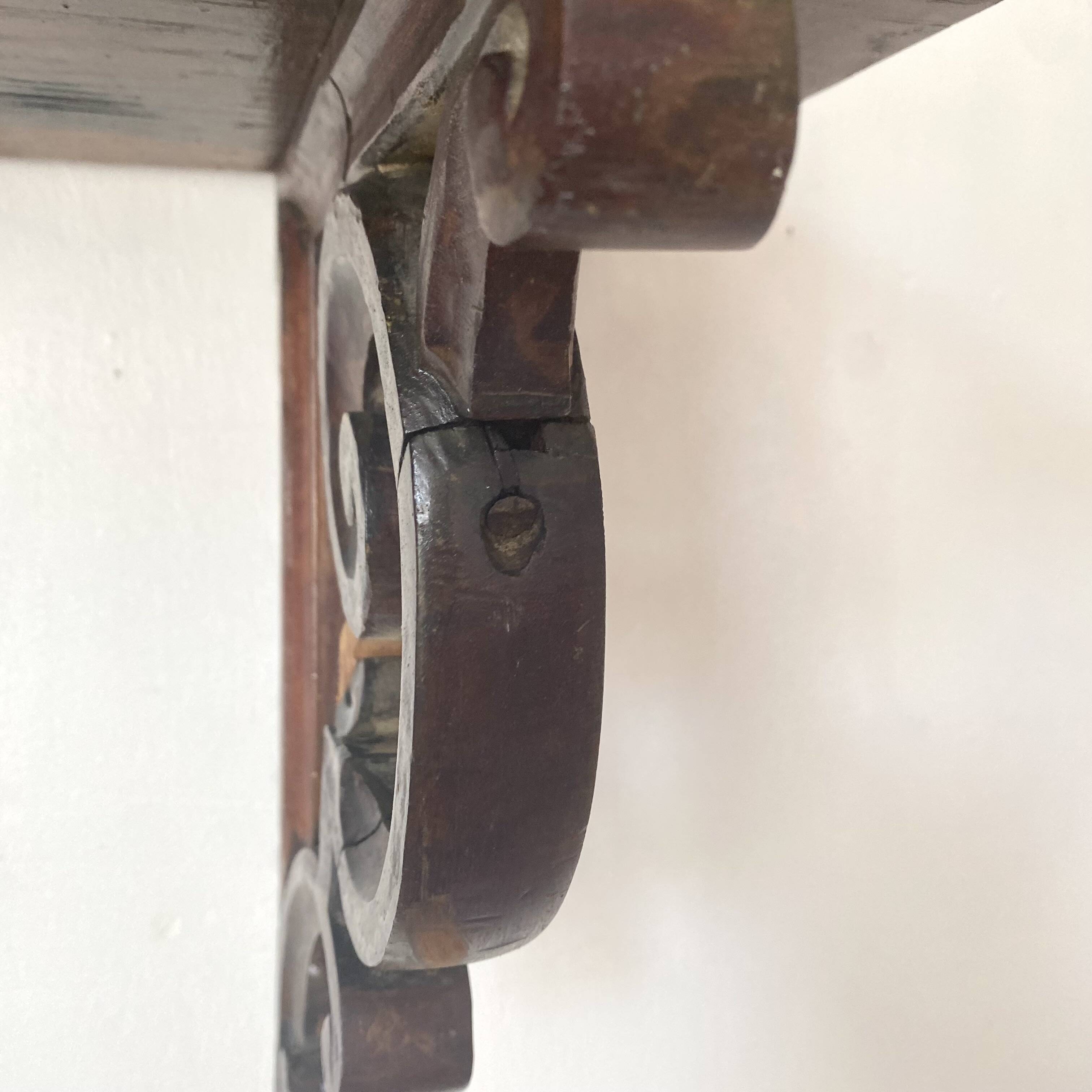 antique oak wall shelf with carved brackets