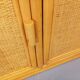 Vintage storage unit in rattan and woven rattan from the 1970s.