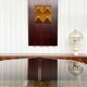 Vintage hexagonal table with smoked glass top and chrome metal structure.
