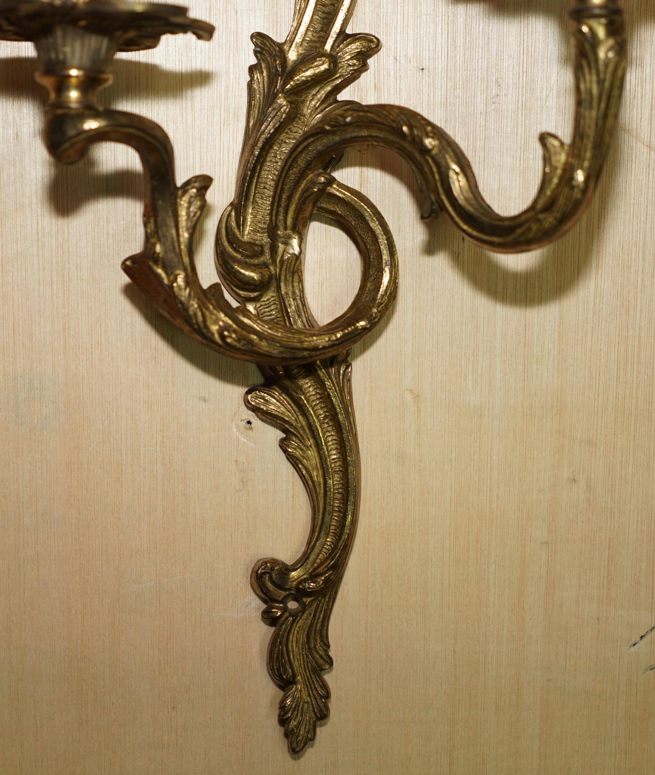 Pair of antique wall sconces from the 1920s in gilded bronze.