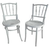 Pair of Lichtig bistro chairs in painted grey beech, pressed seat, circa 1900.