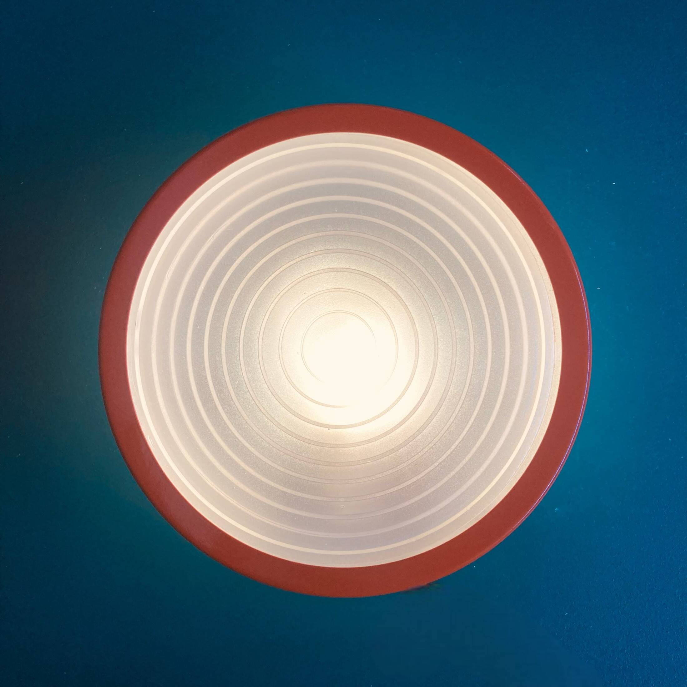 Large round Holophane wall lamp in glass and orange metal, industrial vintage decoration