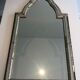 Mirror consisting of multi-faceted mirrors and brass garlands, French work, around 1970