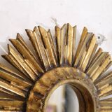 Miroir soleil en bois doré 1950