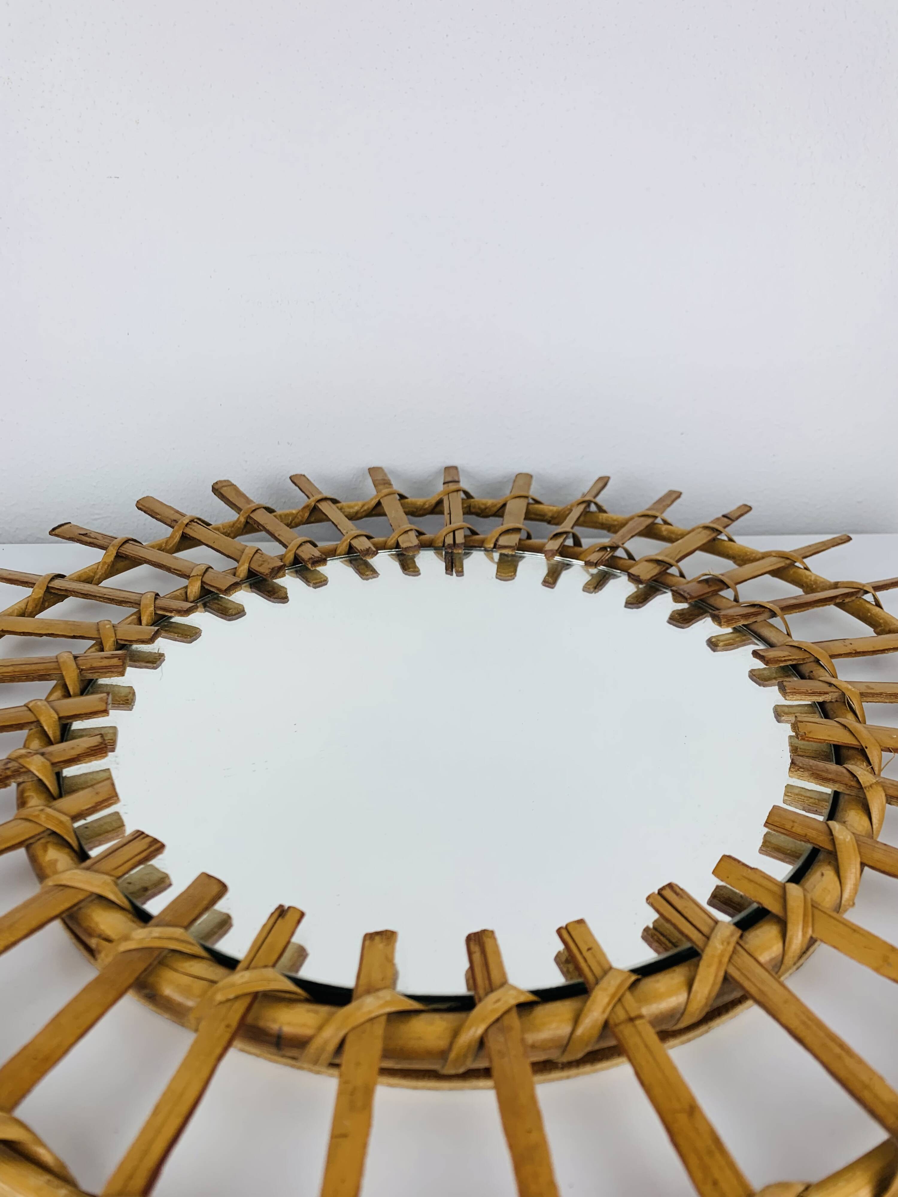 Vintage rattan sunburst mirror from the 1960s