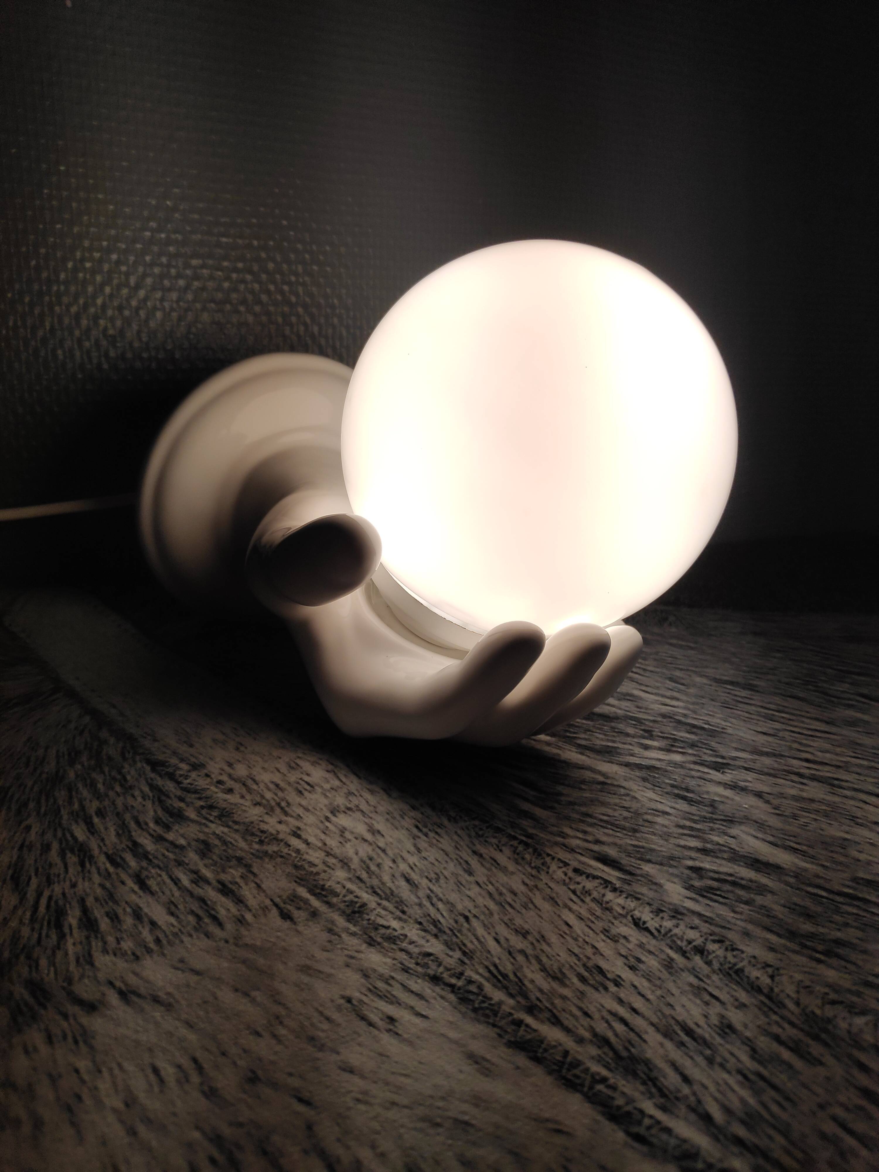 White ceramic hand sconce with white opaline globe