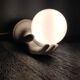 White ceramic hand sconce with white opaline globe