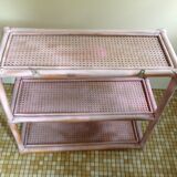 Pink rattan and cane shelf