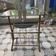 Vintage style side table with magazine holder, gold metal and glass top.