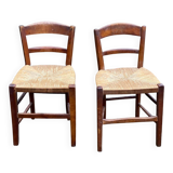 2 solid wood chairs with rush seats, child size.