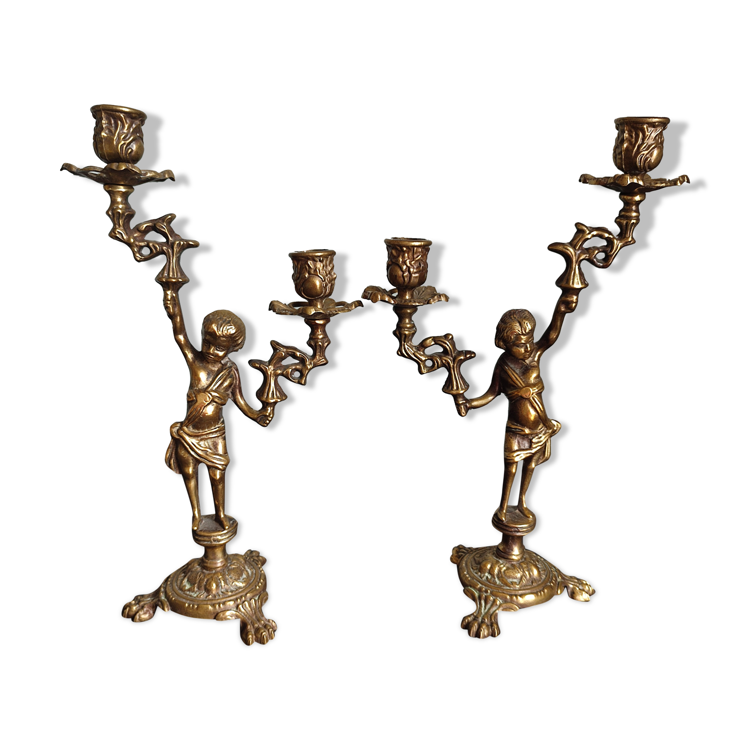 Pair of antique candlesticks in cherub bronze