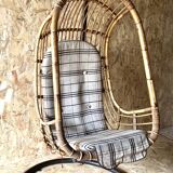 Vintage rattan hanging chair with its stand.