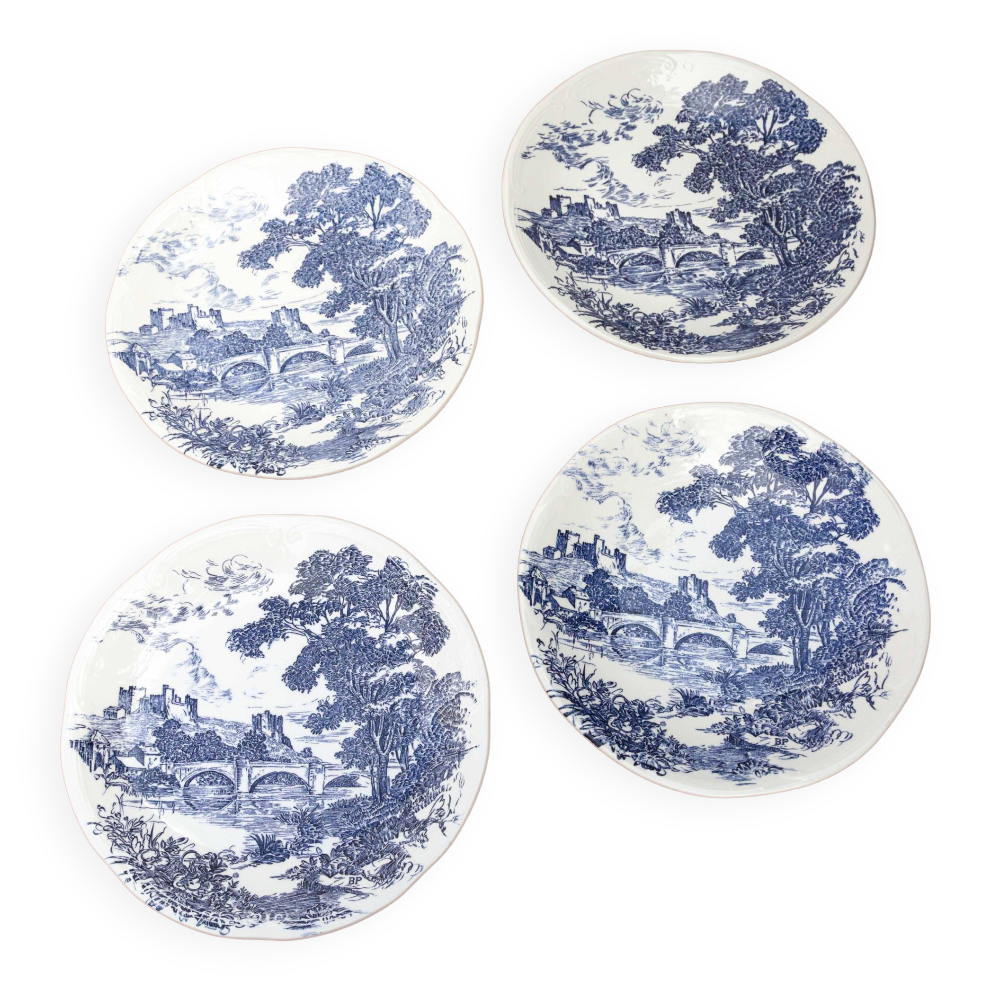 4 blue Gien plates with castle village bridge decor