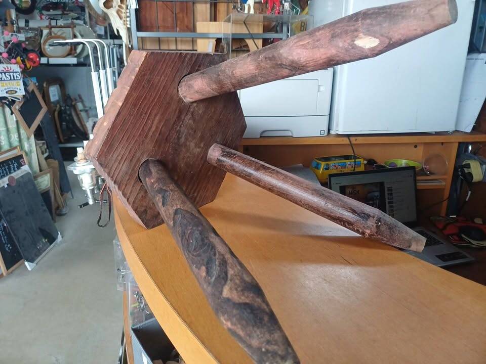 Vintage tripod stool in carved solid wood.
