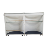 Armoire à barre vintage en forme de cylindre ouvrable, bois, laiton et verre.