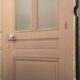 Large glazed door and its old glazed transom.