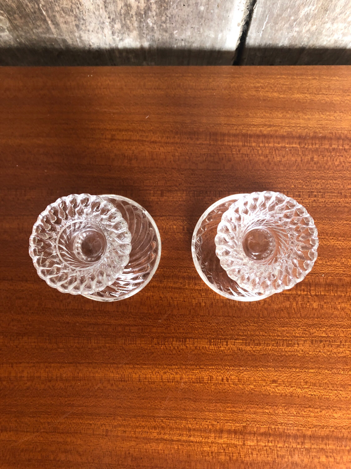 Old pair of vintage round molded glass candle holder