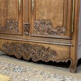 19th-century Norman wedding armoire in blonde oak.