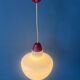 Mid-Century opaline glass suspension with a red upper part and ceiling cover.