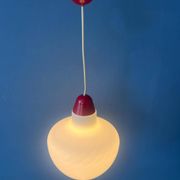 Mid-Century opaline glass suspension with a red upper part and ceiling cover.