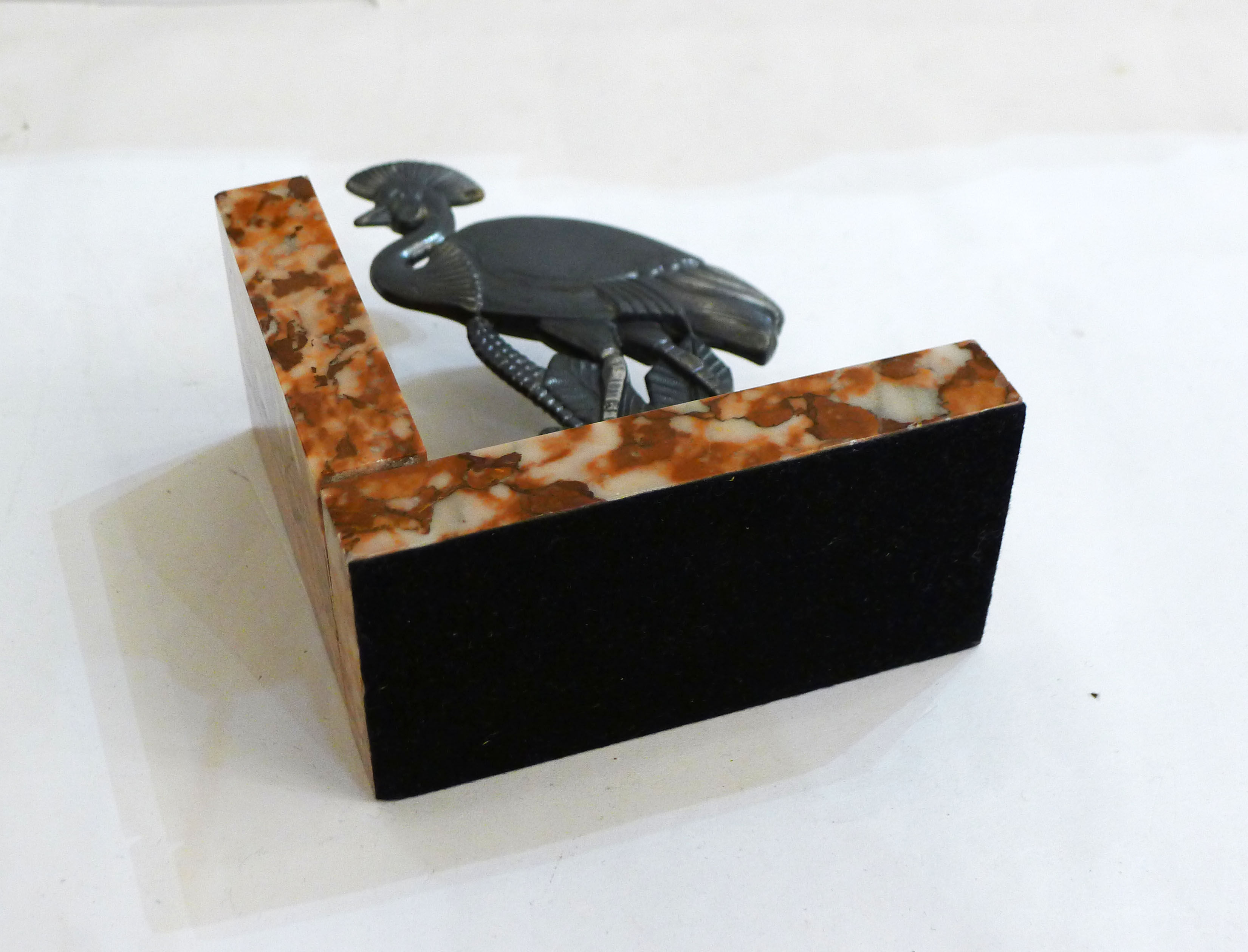 Art Deco bird bookend on marble