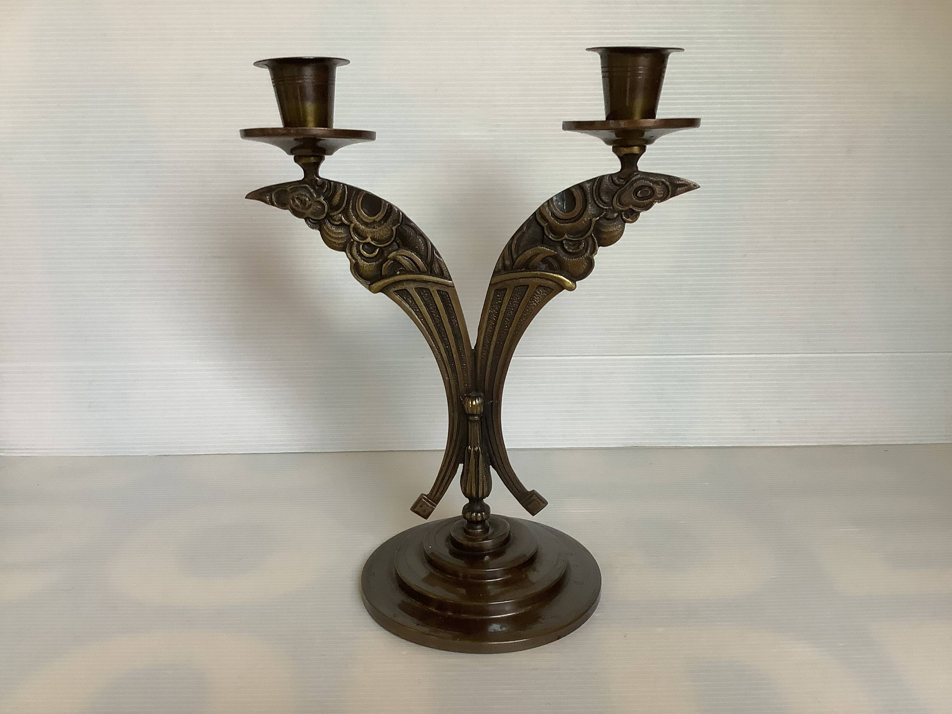 Candle holders in the shape of art deco butterfly wings