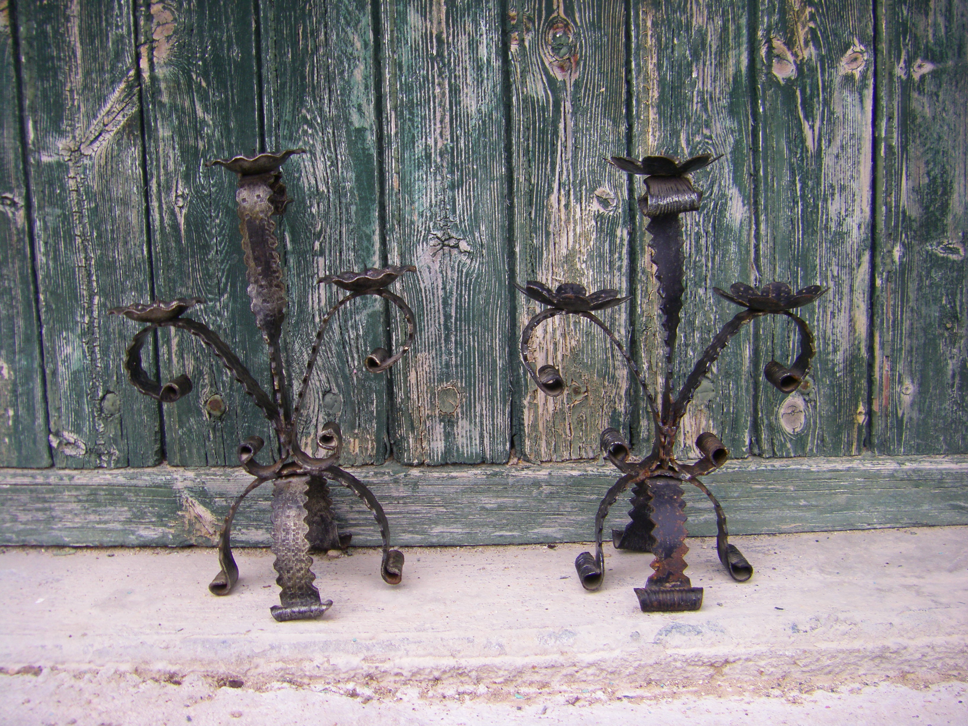 Two wrought iron chandeliers
