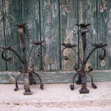 Deux chandeliers en fer forgé