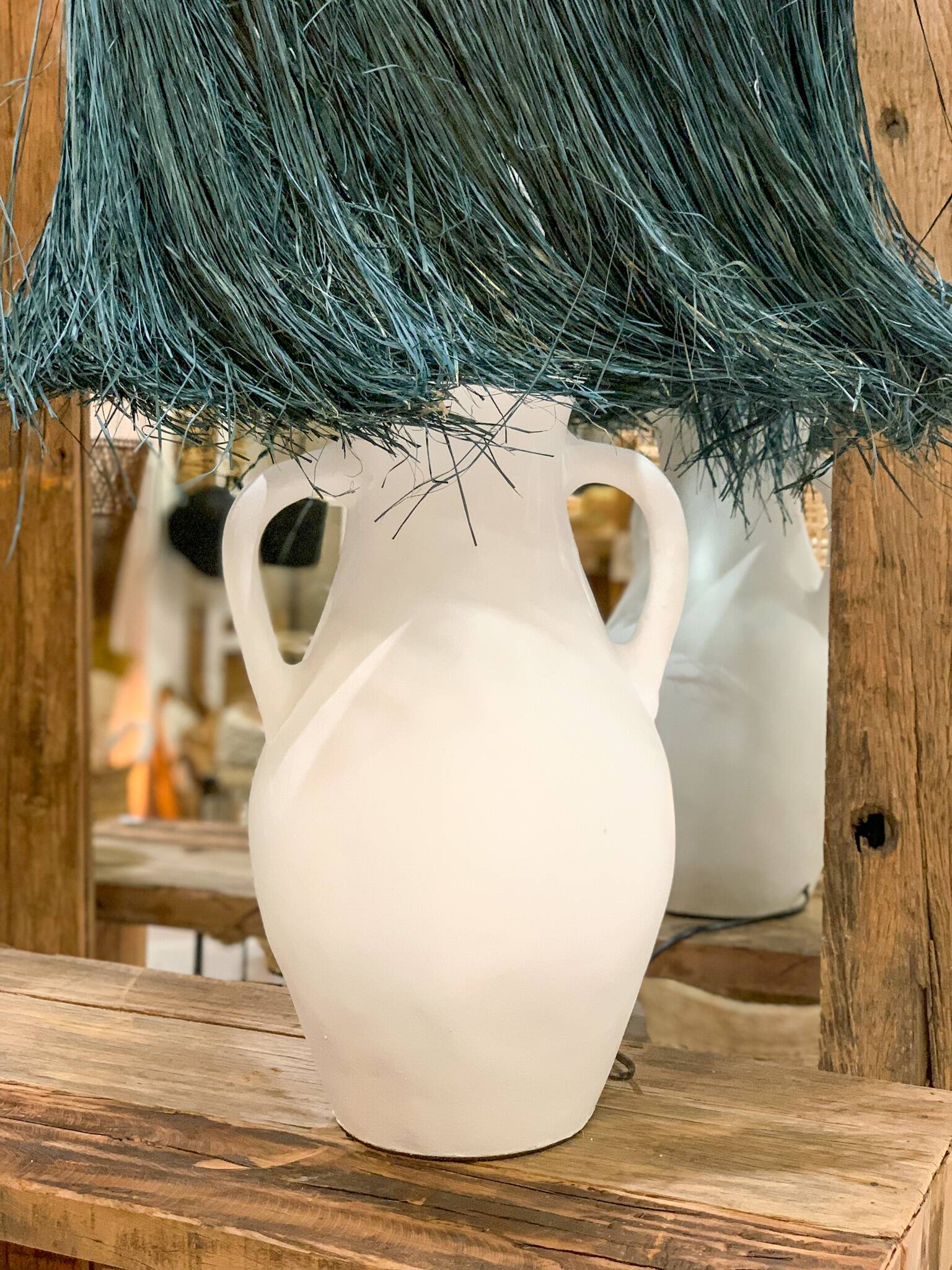 White terracotta lamp and blue raffia lampshade