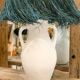 White terracotta lamp and blue raffia lampshade