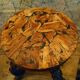 Brutalist tripod stool made from vine stumps.