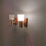 Two smaller wall lamps, made of crystal, rosewood hanging with brass colored details