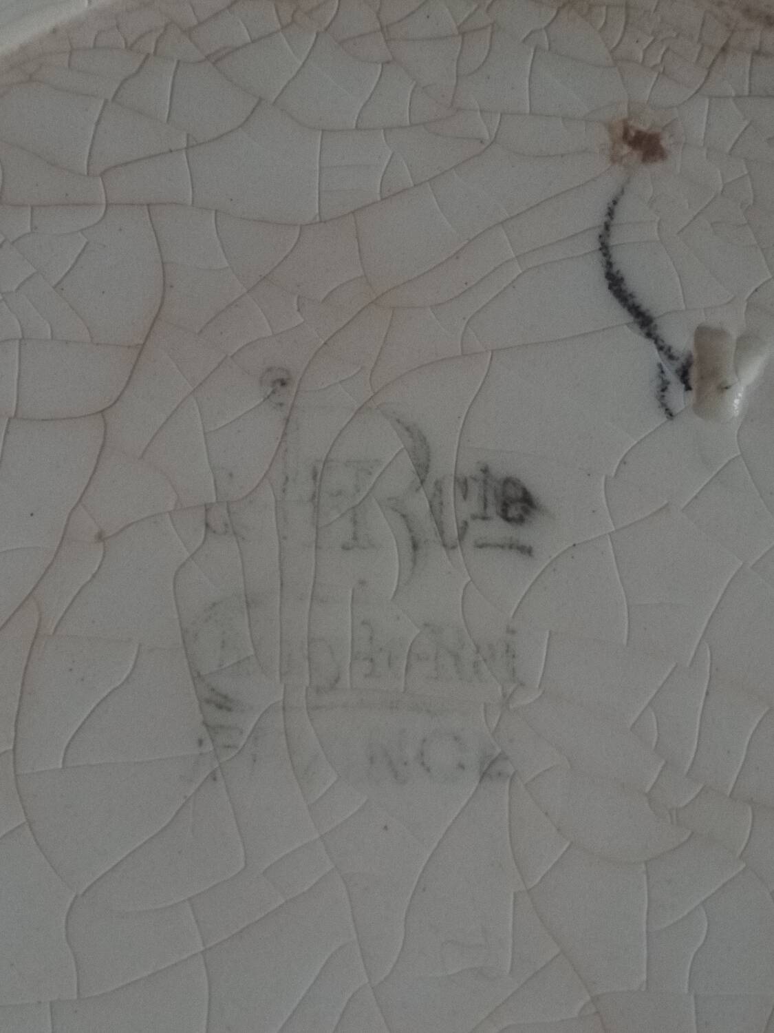 Two earthenware plates, H B, Choisy le roi