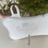 Enamelled sheet metal with inscriptions and hooks