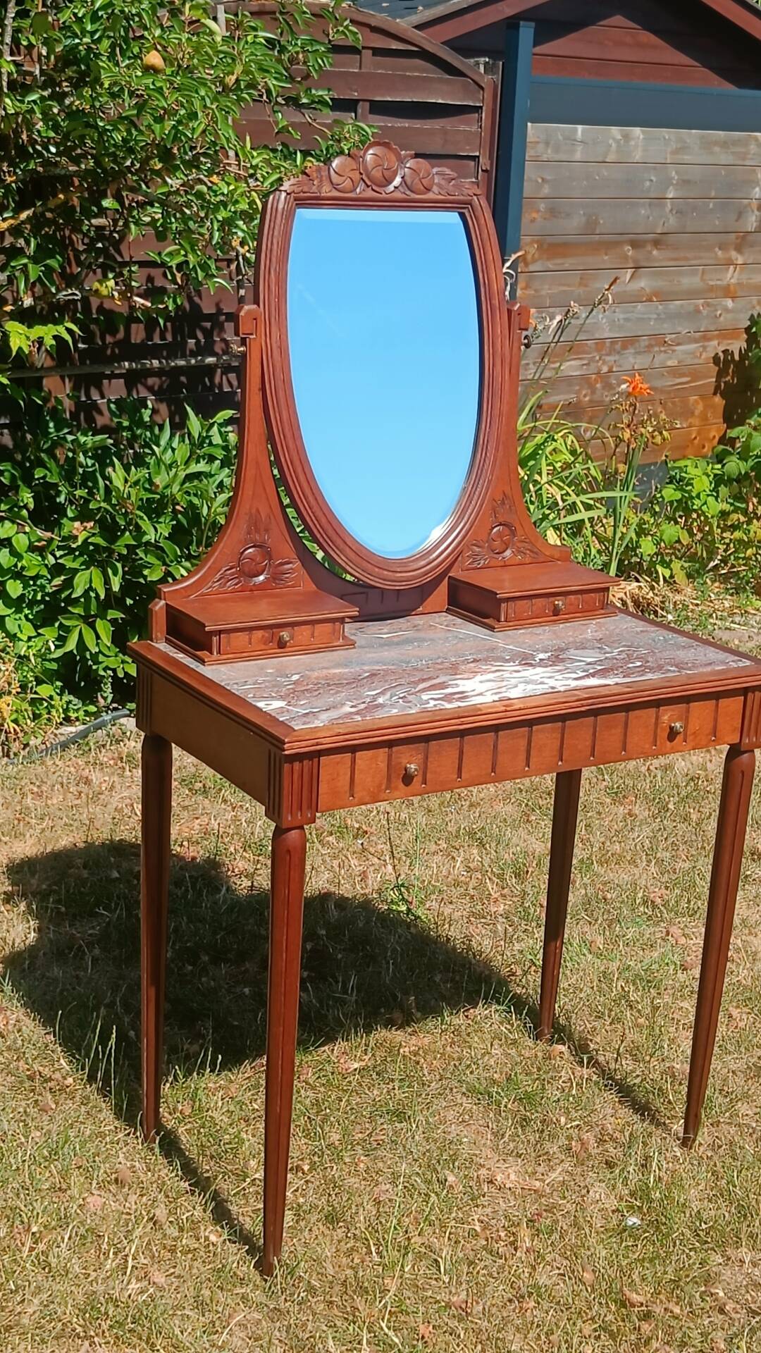 Art Deco oak dressing table, marble top and swivel mirror.