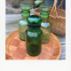 Emerald green glass bottle