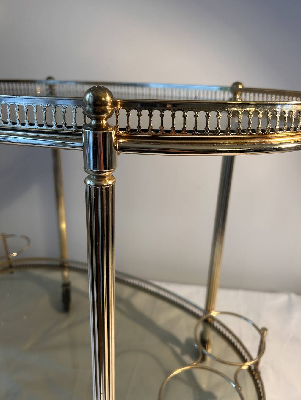 Neoclassical bar cart in gilded brass and smoked glass