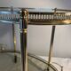 Neoclassical bar cart in gilded brass and smoked glass